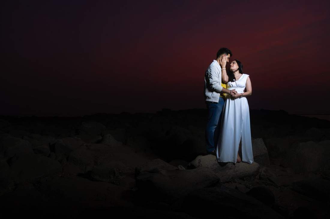 Couple silhouetted at sunset