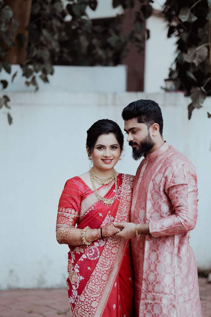Couple in traditional red wedding attire