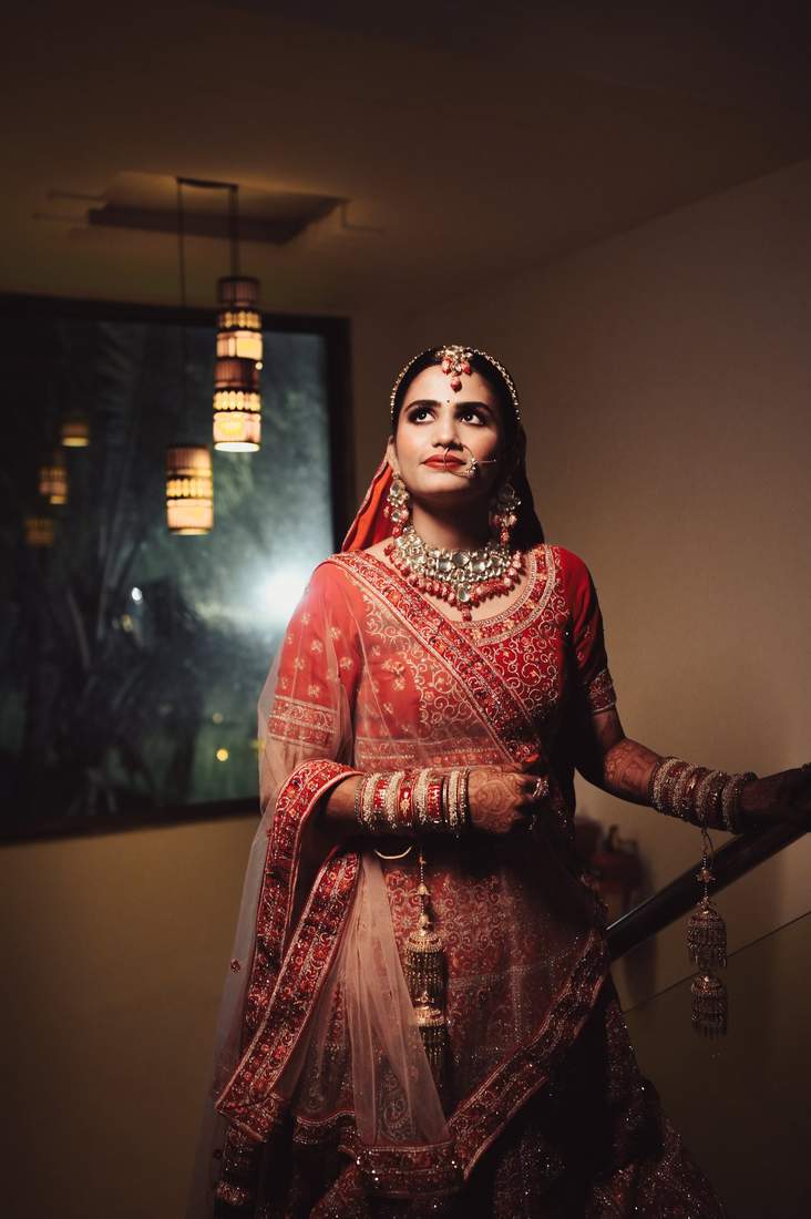 Bride portrait on a staircase under hanging lanterns