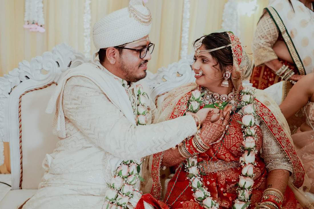 Couple sharing a close moment during the garland ceremony