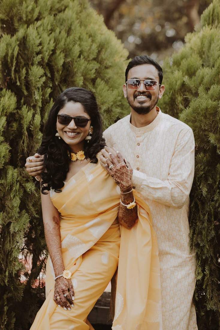 Bride laughing candidly during the mehendi function