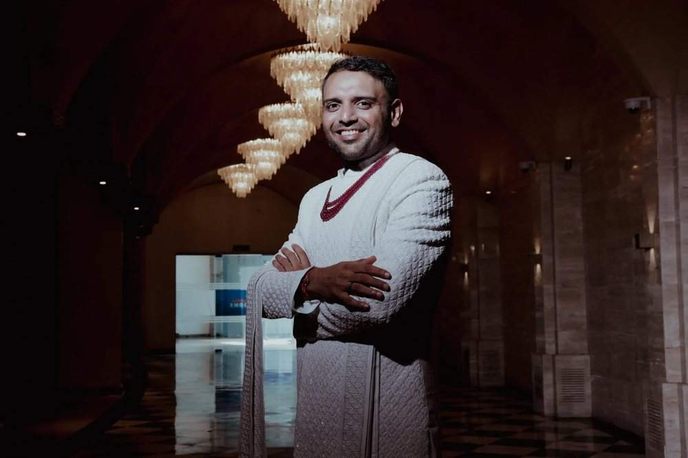 Groom solo portrait in white sherwani