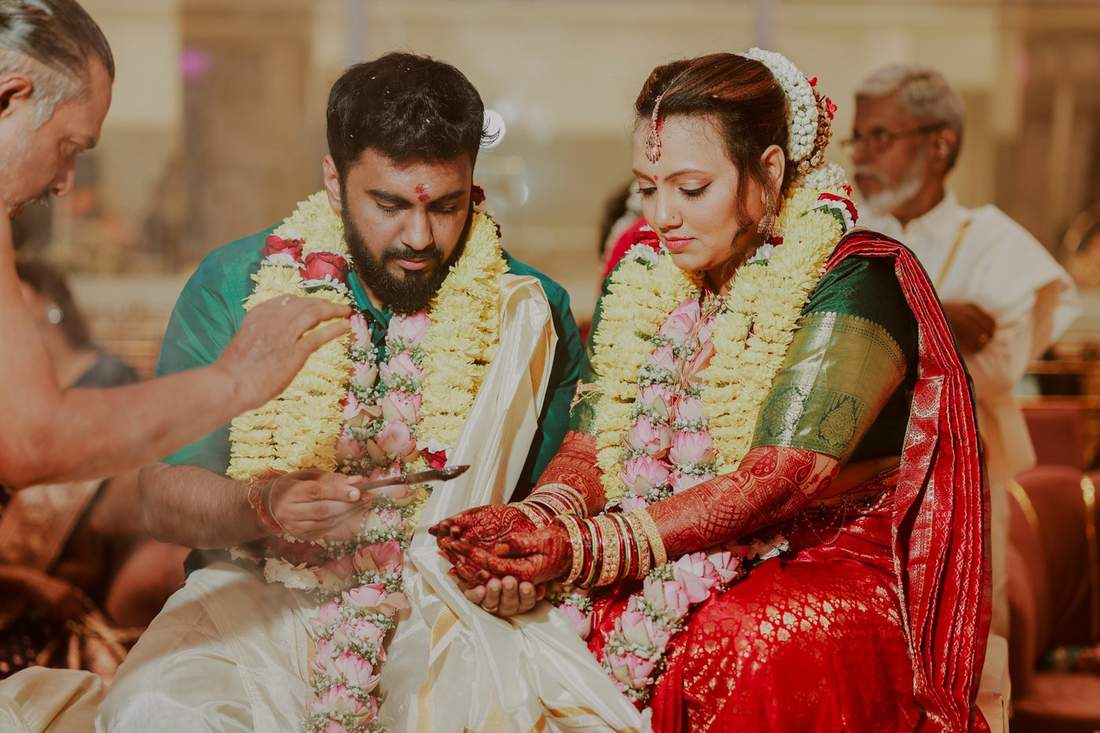 Close detail of hands during a wedding ritual