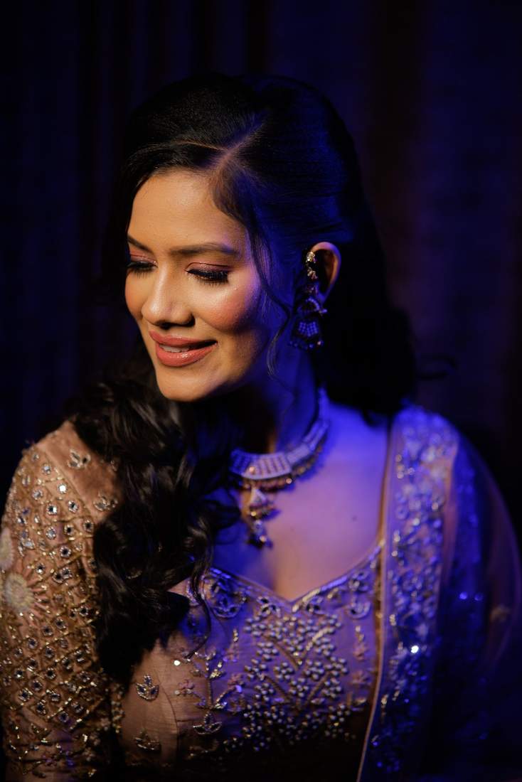 Moody portrait of a bride in coloured light